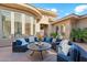 Private courtyard with an outdoor seating area and lush greenery, perfect for relaxation and entertaining at 5291 S Bradshaw Pl, Chandler, AZ 85249