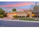 Beautiful single-story home featuring manicured landscaping, a paver driveway, and a two-car garage at sunset at 5291 S Bradshaw Pl, Chandler, AZ 85249