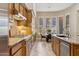 Gourmet kitchen features custom cabinets, stainless appliances and a breakfast bar at 5291 S Bradshaw Pl, Chandler, AZ 85249
