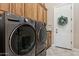 Laundry room featuring a modern LG washer and dryer set, offering efficient and convenient laundry solutions at 5291 S Bradshaw Pl, Chandler, AZ 85249