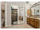 A view from the bathroom featuring the water closet and walk-in closet at 5291 S Bradshaw Pl, Chandler, AZ 85249