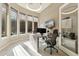 Bright home office with natural light from large windows, modern furnishings, and a sleek workspace at 5291 S Bradshaw Pl, Chandler, AZ 85249