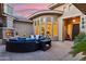 Inviting outdoor patio area with a cozy seating area and fireplace at 5291 S Bradshaw Pl, Chandler, AZ 85249