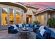 Inviting outdoor patio with blue cushioned seating and decorative plants at 5291 S Bradshaw Pl, Chandler, AZ 85249