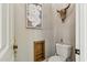 This powder room is complete with a pedestal sink and unique decor at 5291 S Bradshaw Pl, Chandler, AZ 85249