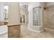 Shower room with glass block window and tile surround at 5291 S Bradshaw Pl, Chandler, AZ 85249