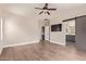 Bright and airy primary bedroom with a barn door leading to an ensuite bathroom at 695 S 221St Dr, Buckeye, AZ 85326