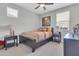Comfortable bedroom featuring a ceiling fan, cozy bed, and bedside tables at 717 N Abalone Ct, Gilbert, AZ 85233