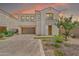 Charming two-story home features a landscaped front yard and a private balcony above the entry at 717 N Abalone Ct, Gilbert, AZ 85233