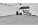 Spacious garage equipped with storage shelves and ample parking space for vehicles at 717 N Abalone Ct, Gilbert, AZ 85233