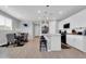 Bright, eat-in kitchen with white cabinetry, granite countertops, and stainless steel appliances at 717 N Abalone Ct, Gilbert, AZ 85233