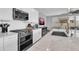 Bright kitchen features stainless appliances, white cabinets, and a large center island at 717 N Abalone Ct, Gilbert, AZ 85233