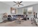 A spacious living room features a sectional sofa and neutral decor that creates a cozy atmosphere at 717 N Abalone Ct, Gilbert, AZ 85233