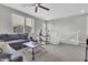 Spacious upstairs loft with a comfortable sofa, providing a great space for relaxing or entertaining at 717 N Abalone Ct, Gilbert, AZ 85233