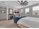Spacious main bedroom features a fireplace, ceiling fan, and TV at 717 N Abalone Ct, Gilbert, AZ 85233
