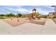 Community playground featuring a slide, swings, and plenty of room to play at 717 N Abalone Ct, Gilbert, AZ 85233