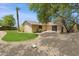 Fenced backyard with gravel and a small grassy area at 7337 E Ivyglen St, Mesa, AZ 85207
