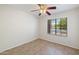 Bedroom with ceramic tile flooring and a window for natural light at 7337 E Ivyglen St, Mesa, AZ 85207