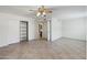Spacious bedroom with tile flooring, neutral walls, and a large closet at 7337 E Ivyglen St, Mesa, AZ 85207