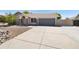 Charming single-story home with well-maintained landscaping and a two-car garage at 7337 E Ivyglen St, Mesa, AZ 85207