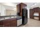 The kitchen features granite countertops, stainless steel dishwasher and ample cabinet space at 7337 E Ivyglen St, Mesa, AZ 85207