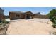 Features a covered patio and a spacious yard ready for custom landscaping at 7648 W Kerby Ave, Phoenix, AZ 85043