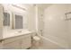 Clean and bright bathroom featuring a tub/shower combination and vanity at 7648 W Kerby Ave, Phoenix, AZ 85043