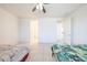 Well-lit bedroom offering tile flooring and a spacious layout at 7648 W Kerby Ave, Phoenix, AZ 85043