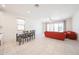 This room features neutral tile floors and a sofa at 7648 W Kerby Ave, Phoenix, AZ 85043