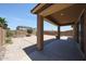 Covered patio offers outdoor relaxation and entertaining space with a spacious backyard and landscaping at 7648 W Kerby Ave, Phoenix, AZ 85043