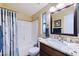 Bathroom featuring granite countertops, wood cabinets, and tiled shower/tub at 8500 E Southern Ave # 510, Mesa, AZ 85209