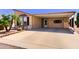Covered carport with decorated walls and a pristine, spacious concrete floor at 8500 E Southern Ave # 510, Mesa, AZ 85209