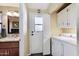 Laundry room with washer, dryer, cabinets and access to the backyard at 8500 E Southern Ave # 510, Mesa, AZ 85209