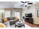Inviting living room with a ceiling fan, sliding glass doors, and a comfortable sectional sofa at 8500 E Southern Ave # 510, Mesa, AZ 85209