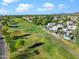 Scenic aerial view of a golf course community with mature landscaping and mountains at 8653 S 51St St # 2, Phoenix, AZ 85044