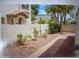 Landscaped backyard with brick-lined walkway and mature shrubs at 8653 S 51St St # 2, Phoenix, AZ 85044