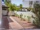 Private backyard patio with red brick pathway and gravel bed at 8653 S 51St St # 2, Phoenix, AZ 85044
