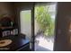 Dining area with view of the private backyard and patio area through a sliding glass door at 8653 S 51St St # 2, Phoenix, AZ 85044