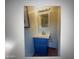 Bathroom vanity featuring blue cabinet, white countertop, and tile flooring at 8653 S 51St St # 2, Phoenix, AZ 85044