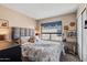 Cozy bedroom with a plush bed, stylish headboard, and a sunny window with view at 8653 S 51St St # 2, Phoenix, AZ 85044