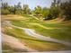 View of a golf course with winding pathways and well manicured green grass at 8653 S 51St St # 2, Phoenix, AZ 85044