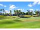 Lush green golf course lined with trees and residential homes, scenic and serene at 8653 S 51St St # 2, Phoenix, AZ 85044