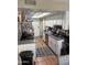 Kitchen with stainless steel appliances, white cabinets, tile flooring, and a skylight at 8653 S 51St St # 2, Phoenix, AZ 85044
