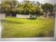 Expansive green lawn with mature trees and landscaping at 8653 S 51St St # 2, Phoenix, AZ 85044