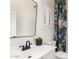 Stylish bathroom with a modern vanity, floral shower curtain, and black hardware at 896 E Indian Wells Pl, Chandler, AZ 85249