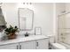 Well-lit bathroom featuring a marble countertop vanity, modern mirror and a shower at 896 E Indian Wells Pl, Chandler, AZ 85249