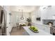 Eat-in kitchen with white cabinets, marble countertops, stainless steel appliances, and window shutters at 896 E Indian Wells Pl, Chandler, AZ 85249