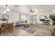 Bright and airy living room featuring modern decor, light-colored wood floors and plantation shutters at 896 E Indian Wells Pl, Chandler, AZ 85249