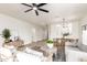 Comfortable living room with modern furnishings, light wood floors, and ample natural light at 896 E Indian Wells Pl, Chandler, AZ 85249