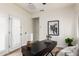 Bright office space featuring a modern desk, plantation shutters, and neutral color palette at 896 E Indian Wells Pl, Chandler, AZ 85249